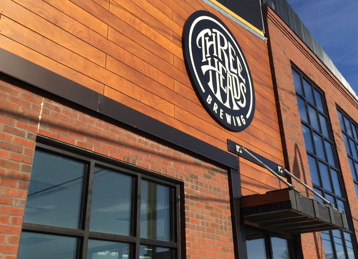 Three Heads Brewing building signage completed in March 2016.